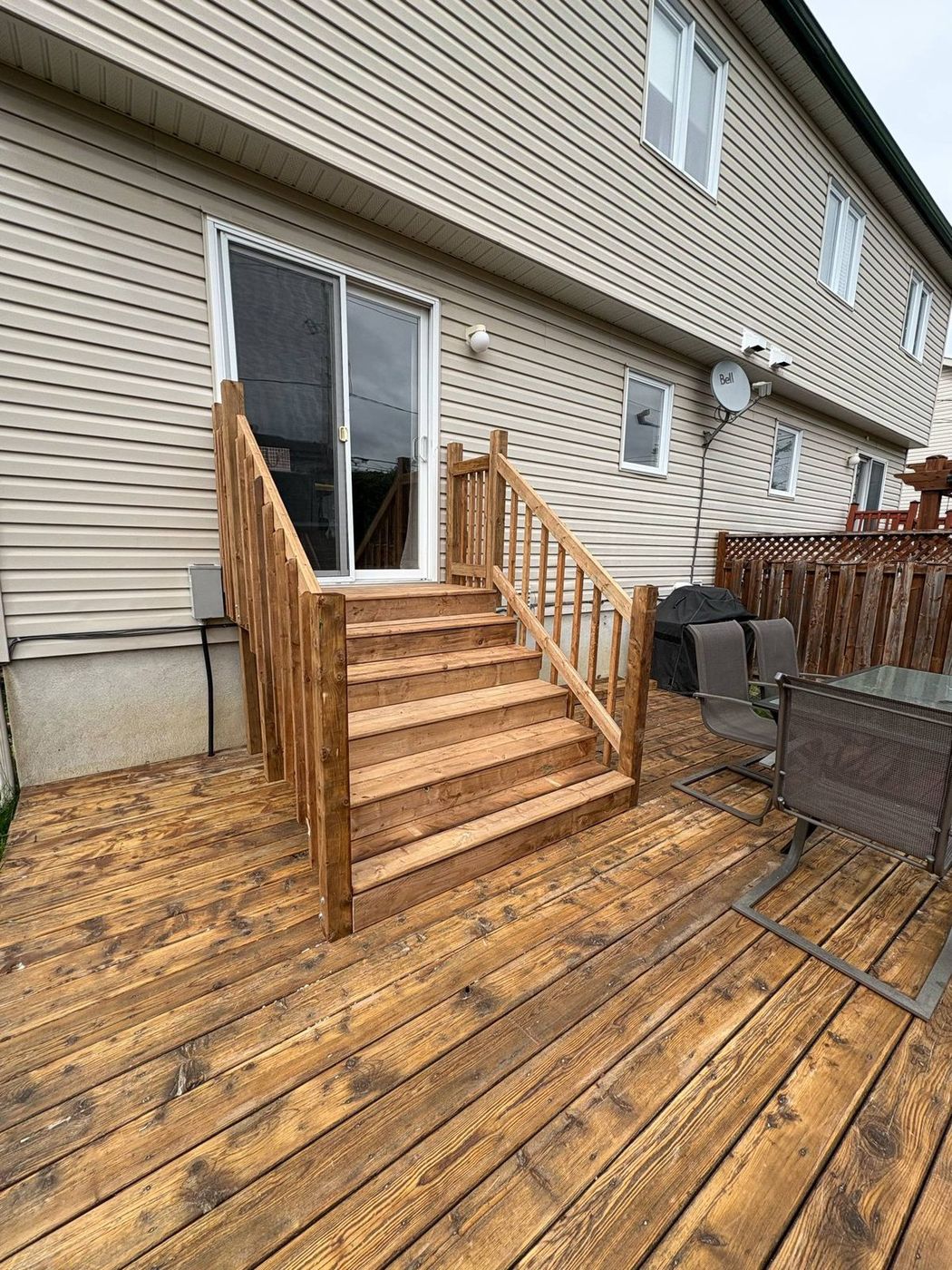 Rebuilt and stained cedar deck stairs and railing